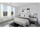 Well-lit bedroom featuring a comfortable bed, modern decor, and scenic neighborhood views at 4273 Ridgewalk Pt, Castle Rock, CO 80108