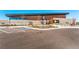 Modern building with unique architecture, a parking area, and landscaped surroundings at 4273 Ridgewalk Pt, Castle Rock, CO 80108