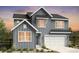 Charming two-story home with gray siding, a two-car garage, and a well-manicured front yard at 4273 Ridgewalk Pt, Castle Rock, CO 80108