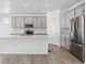 Modern kitchen with a large island, stainless steel appliances, and ample cabinet space at 4273 Ridgewalk Pt, Castle Rock, CO 80108