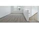 Loft area with plush carpet and stairs leading to the next level at 4273 Ridgewalk Pt, Castle Rock, CO 80108