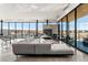 Bright, modern lounge with large windows and an open-concept seating area at 4273 Ridgewalk Pt, Castle Rock, CO 80108
