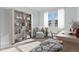 Bright office space featuring hardwood floors, a bookshelf, and a neutral chair, perfect for a home office at 4273 Ridgewalk Pt, Castle Rock, CO 80108