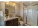 Bathroom with a glass enclosed shower, vanity, and updated fixtures at 7312 Grady Cir, Castle Rock, CO 80108