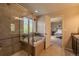 Spacious bathroom with tiled shower, soaking tub, and access to main bedroom at 7312 Grady Cir, Castle Rock, CO 80108