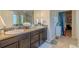 Bathroom featuring double sinks, granite countertop, and modern finishes at 7312 Grady Cir, Castle Rock, CO 80108