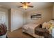 Cozy bedroom featuring a ceiling fan, closet, and landscape artwork at 7312 Grady Cir, Castle Rock, CO 80108