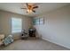 Bedroom featuring a large window, cat tree, and neutral decor at 7312 Grady Cir, Castle Rock, CO 80108
