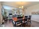 Elegant dining room featuring an open layout with hardwood floors and views to the living room at 7312 Grady Cir, Castle Rock, CO 80108