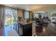 Open-concept kitchen with granite countertops, a center island, and access to the outdoor patio at 7312 Grady Cir, Castle Rock, CO 80108
