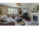 Bright living room featuring large windows, hardwood floors, and a cozy seating area with decor at 7312 Grady Cir, Castle Rock, CO 80108
