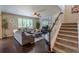 Inviting living room with hardwood floors, neutral tones, and cozy furniture at 7312 Grady Cir, Castle Rock, CO 80108