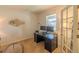 Bright home office with a large window, modern desk setup, and french door entryway at 7312 Grady Cir, Castle Rock, CO 80108