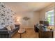 Comfortable office with floral wallpaper, sofa, work desk, and natural light at 7312 Grady Cir, Castle Rock, CO 80108