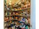 Walk-in pantry with ample storage shelves filled with a variety of household and food items at 7312 Grady Cir, Castle Rock, CO 80108