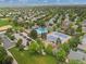 Aerial view of community clubhouse featuring a pool, tennis courts, parking and green space in a residential neighborhood at 10510 Berthoud Way, Parker, CO 80134