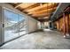 Unfinished basement with a sliding door and a stairway to the backyard at 10510 Berthoud Way, Parker, CO 80134