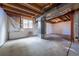 Spacious unfinished basement with concrete floors and exposed ceiling, ready for customization at 10510 Berthoud Way, Parker, CO 80134