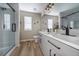 Beautiful bathroom featuring quartz countertop, modern vanity and tile flooring at 10510 Berthoud Way, Parker, CO 80134