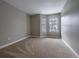 Bright bedroom with neutral carpet and gray walls at 10510 Berthoud Way, Parker, CO 80134