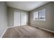 Bedroom with closet, carpet flooring, neutral colored walls and a window to let in natural light at 10510 Berthoud Way, Parker, CO 80134