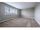 Bedroom with large window and neutral carpet at 10510 Berthoud Way, Parker, CO 80134