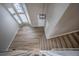 Entryway with wood floors, and carpeted stairs, and vaulted ceiling at 10510 Berthoud Way, Parker, CO 80134