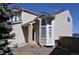 Stylish home exterior featuring a covered front entry, bay windows, and low-maintenance landscaping at 10510 Berthoud Way, Parker, CO 80134