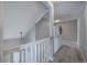 Second story hallway featuring carpet and white railing at 10510 Berthoud Way, Parker, CO 80134