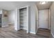 Hallway features wood floors, a pantry, and access to the front door at 10510 Berthoud Way, Parker, CO 80134