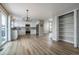 Bright and open kitchen area with modern appliances, lighting, and pantry at 10510 Berthoud Way, Parker, CO 80134