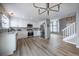 Modern kitchen with stainless steel appliances, white cabinets, and hardwood floors at 10510 Berthoud Way, Parker, CO 80134