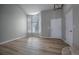 Living room area showcasing large bay windows providing ample natural light and hardwood floors at 10510 Berthoud Way, Parker, CO 80134