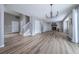 Spacious living room featuring a fireplace, ample natural light, and stylish wood flooring at 10510 Berthoud Way, Parker, CO 80134