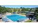 Community pool features a recreational space for residents with many chairs and tables available for enjoyment at 10510 Berthoud Way, Parker, CO 80134