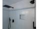 Close-up of a modern shower with rainfall showerhead and built-in niche at 10510 Berthoud Way, Parker, CO 80134