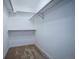 Walk-in closet with carpet and shelving for organizing clothes and accessories at 10510 Berthoud Way, Parker, CO 80134