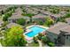 An aerial view of a blue community pool surrounded by lovely homes and landscaped grounds at 12912 Grant Cir # A, Thornton, CO 80241