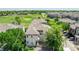 Aerial view of the neighborhood and the home's location near green spaces and the golf course at 12912 Grant Cir # A, Thornton, CO 80241