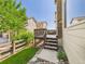 Wooden deck on the back of the house with steps leading to the backyard at 12912 Grant Cir # A, Thornton, CO 80241