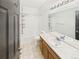 Bright bathroom with a mirror, vanity, tub, and a shower at 12912 Grant Cir # A, Thornton, CO 80241
