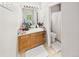 Bathroom features a vanity, mirror, lighting, and a shower with a white curtain at 12912 Grant Cir # A, Thornton, CO 80241