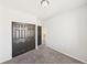 Carpeted bedroom with a closet and a door leading to the hallway at 12912 Grant Cir # A, Thornton, CO 80241