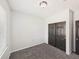 Bright bedroom featuring gray walls and plush carpeting at 12912 Grant Cir # A, Thornton, CO 80241