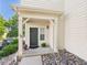 Charming front door with neutral siding, river rock bed, and a cozy covered entrance at 12912 Grant Cir # A, Thornton, CO 80241
