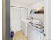 Cozy laundry room with washer, dryer and storage shelves at 12912 Grant Cir # A, Thornton, CO 80241
