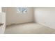 Bright bedroom with a window, neutral carpet, and ample space at 4212 W Pondview Dr, Littleton, CO 80123