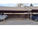 Carport with space for parking with visible address number on the facade at 4212 W Pondview Dr, Littleton, CO 80123