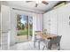 Cozy eat-in kitchen with access to the outdoor patio and well lit with natural light at 4212 W Pondview Dr, Littleton, CO 80123