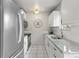 Modern kitchen with stainless steel appliances, granite counters, and tile backsplash at 4212 W Pondview Dr, Littleton, CO 80123